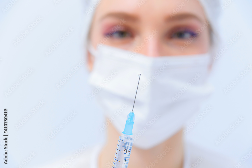 Doctor filling syringe with medication, closeup. Vaccination and immunization Doctor filling syringe with medication, closeup. Vaccination and immunization