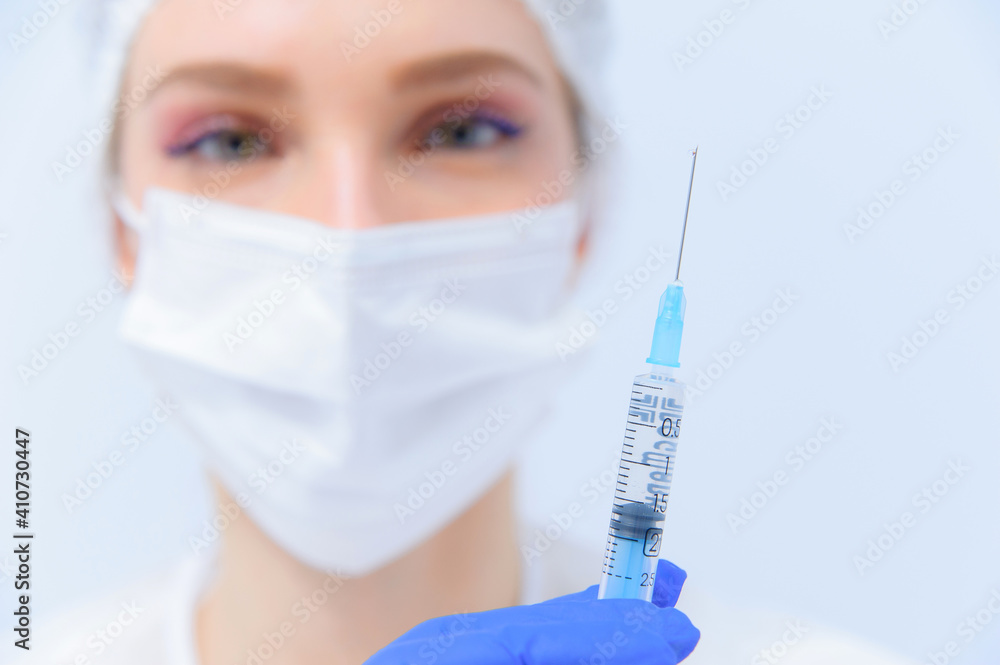 Doctor filling syringe with medication, closeup. Vaccination and immunization Doctor filling syringe with medication, closeup. Vaccination and immunization