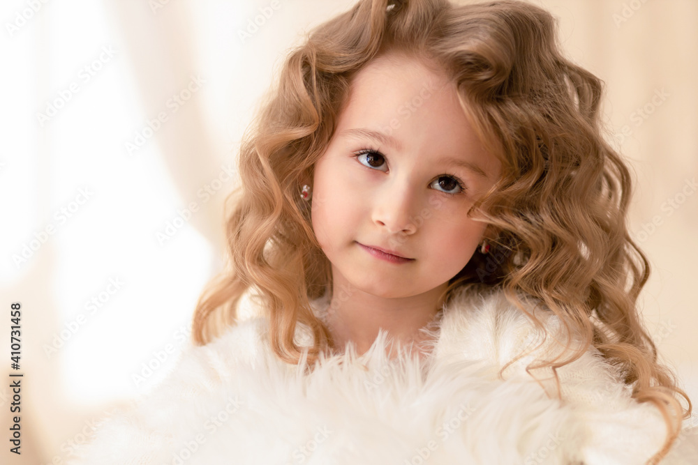 portrait of little beautiful caucasian girl with long curly white hair, brown eyes. condescending, reproachful expression on the face of child. human emotions. closeup portrait of little beautiful caucasian girl with long curly white hair, brown eyes. condescending, reproachful expression on the face of child. human emotions. closeup