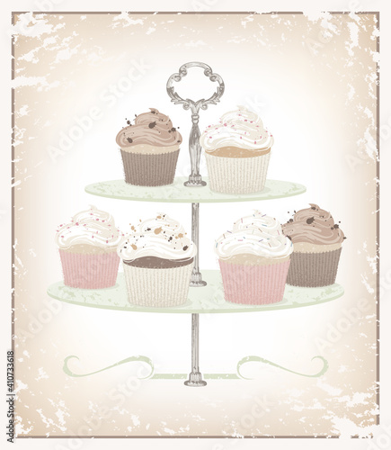 A variety of cupcakes on a serving dish made of textures and soft colors
