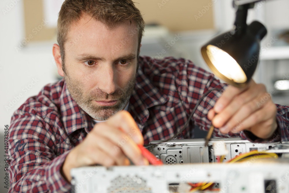 technician fixing a computer