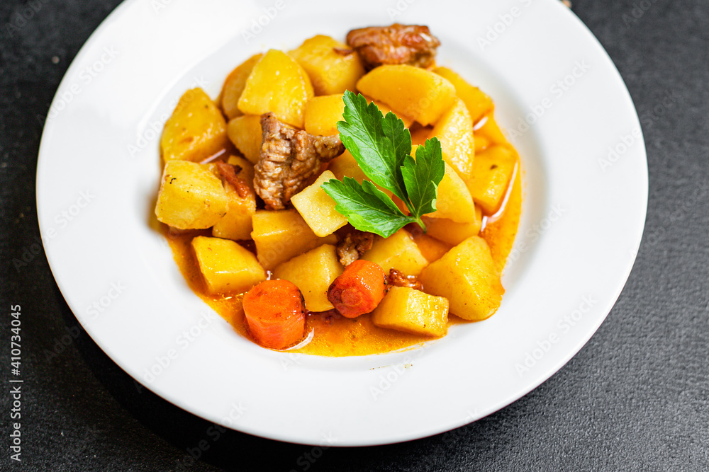 stewed potatoes and meat roast vegetables goulash portion on the table for healthy meal snack outdoor top view copy space for text food background rustic image stewed potatoes and meat roast vegetables goulash portion on the table for healthy meal snack outdoor top view copy space for text food background rustic image