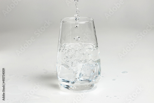 Glass of mineral carbonated water with ice