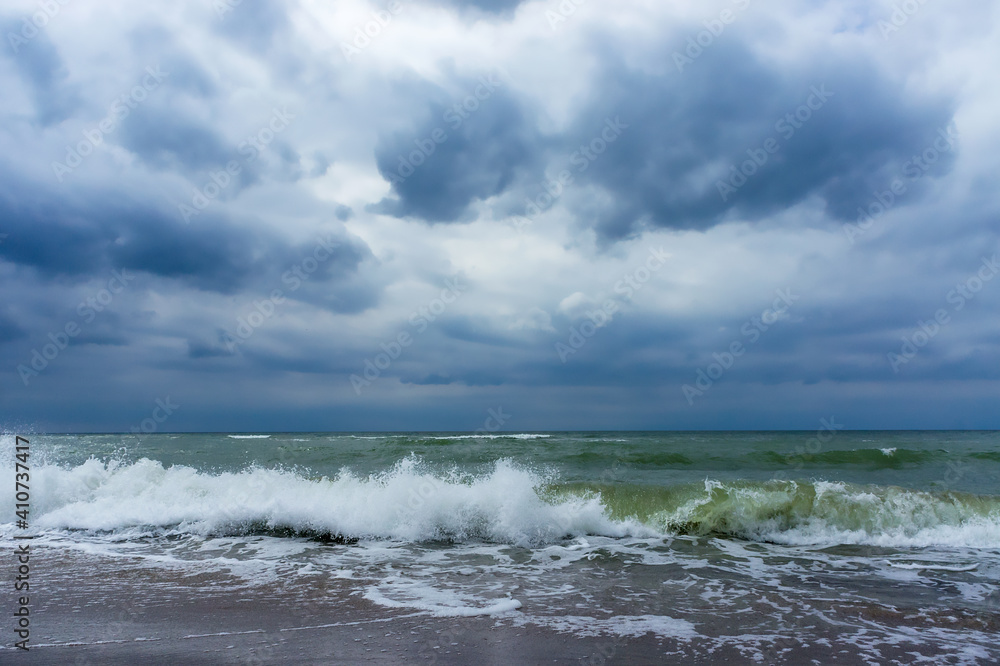 Seacoast. Tides and storms at sea. Waves on the Baltic Sea. Deserted seashore.