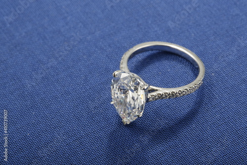 Diamond engagement ring on blue