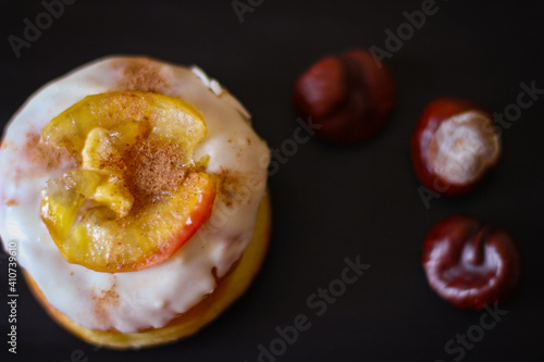 Delicious Donuts with apple and cinnamon on a black background