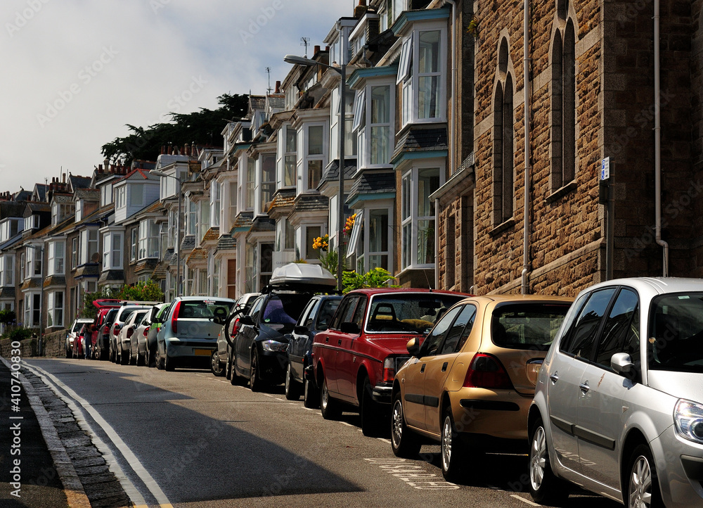 Cars Parking In Front Of Charming Row Houses At Bedford Road St Ives Cornwall England On A Sunny Summer Day With A Few Clouds In The Sky