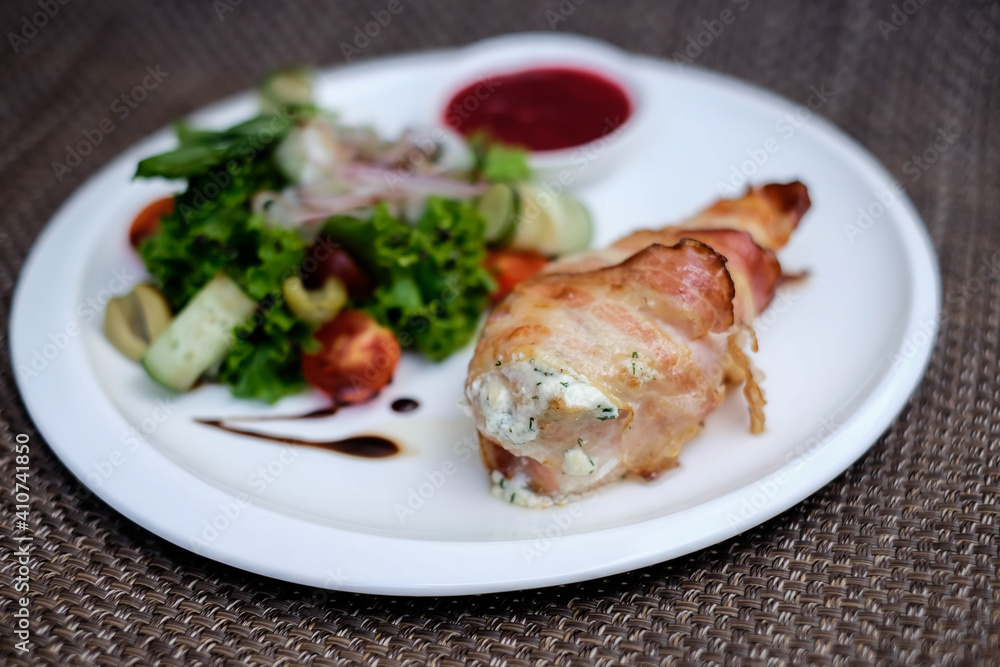 Chicken breast stuffed with cheese sauce and wrapped in pancetta bacon. Chicken breast stuffed with cheese sauce and wrapped in pancetta bacon.