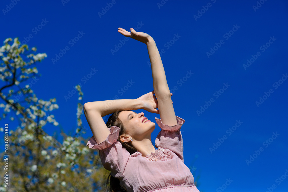 Woman happy smiling joyful with arms up dancing in summer during holidays travel Woman happy smiling joyful with arms up dancing in summer during holidays travel