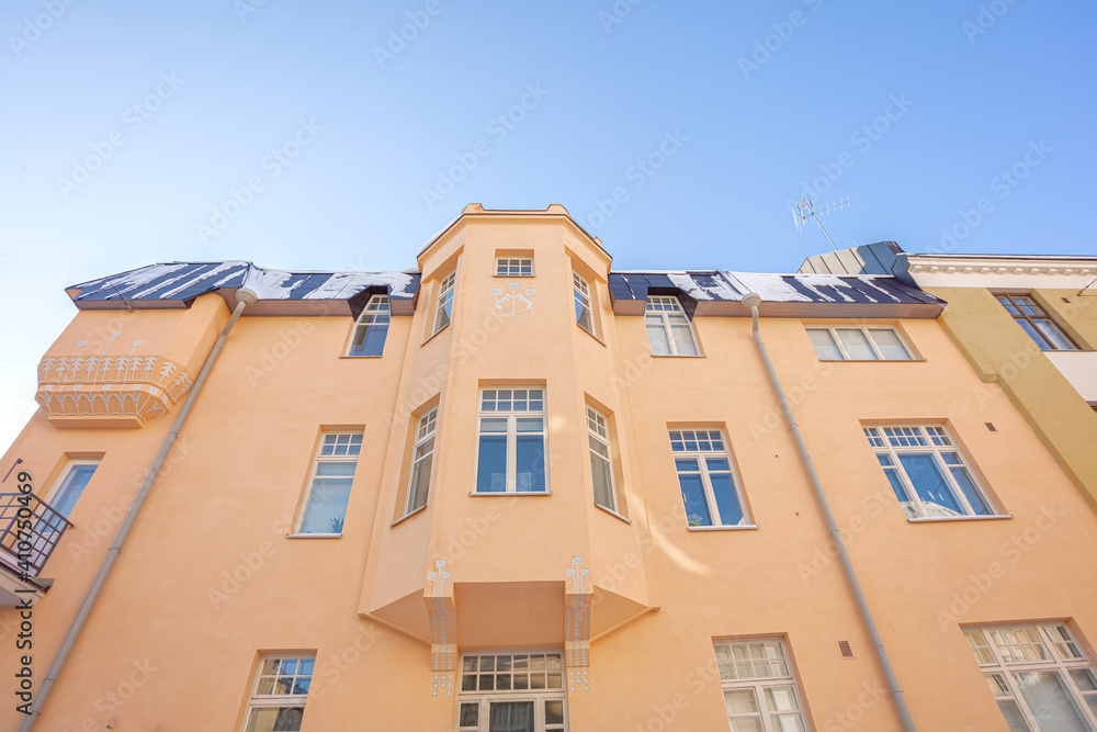 Fototapeta premium Facades and roofs of ancient buildings of the 19th century in the Ulyanin area, Helsinki, Finland