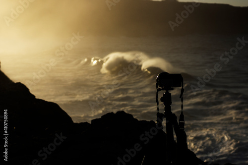 Camera filming huge waves hitting the cliff and exploding