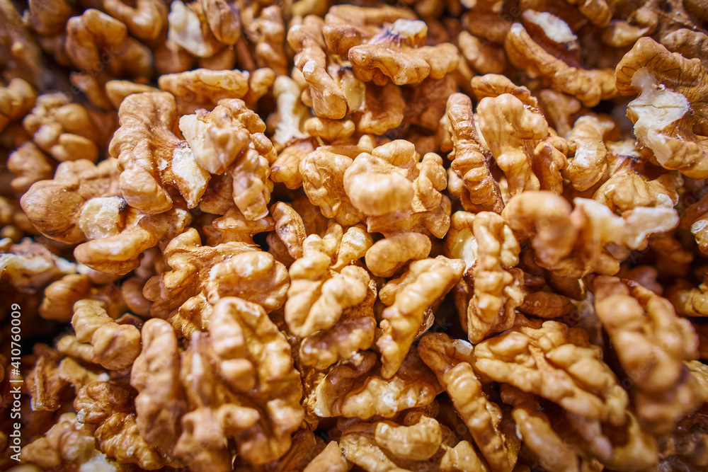 Heap of peeled walnuts background Heap of peeled walnuts background
