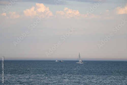 yachts and boats float on the ocean under a beautiful sky © Serhii Photography