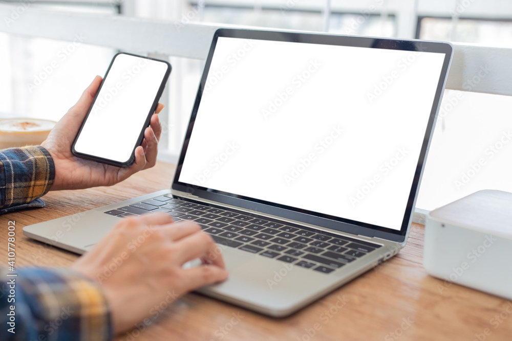 computer screen,cell phone blank mockup.hand woman work using laptop texting mobile.with white background for advertising,contact business search information on desk in cafe.marketing,design computer screen,cell phone blank mockup.hand woman work using laptop texting mobile.with white background for advertising,contact business search information on desk in cafe.marketing,design