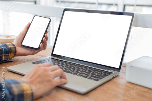 computer screen,cell phone blank mockup.hand woman work using laptop texting mobile.with white background for advertising,contact business search information on desk in cafe.marketing,design