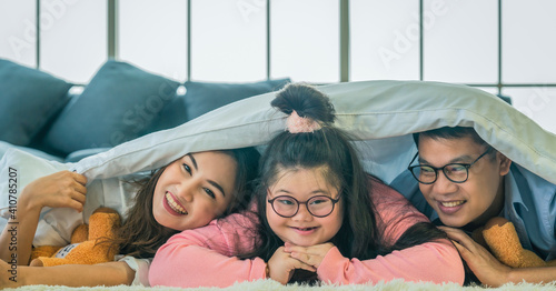 down syndrome eenage girl having good time together with family