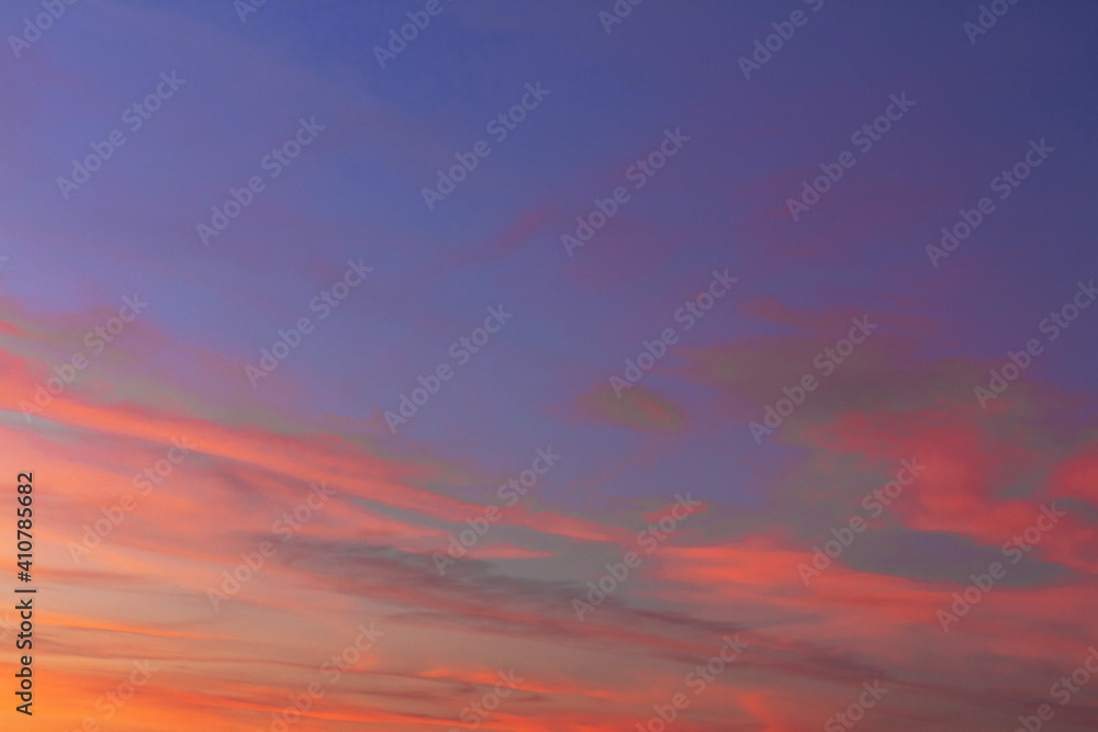 The sky and clouds just before sunset. The sky and clouds are plastered with red from the sun.