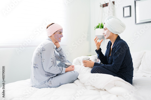Female best friends sharing personal stuff in a slumber party