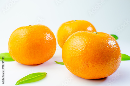 Orange on white background isolated, Asian tropical fruits whole good for healthy drinks and juice. Very natural sweet flavor. Tangerine, mandarine, Thai honey sweet green. Close up shot food concept
