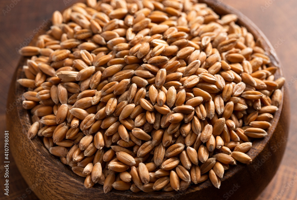 Bowl of Spelt Grain on a Wooden Butchers Block Bowl of Spelt Grain on a Wooden Butchers Block