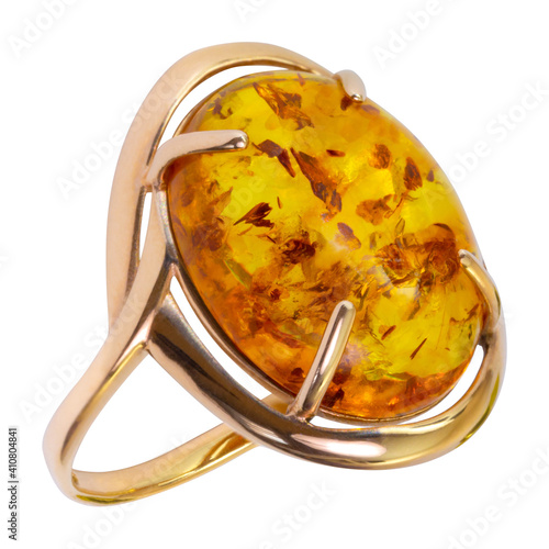 Gold ring with amber isolated on white background, closeup