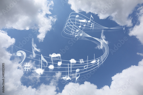 View of beautiful sky with clouds and flying music notes