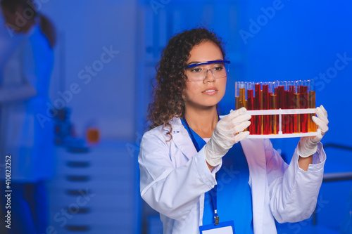 Female scientist with sampl...