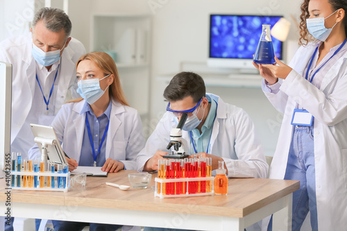 Scientists working with sam...