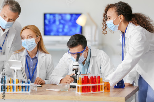 Scientists working with sam...