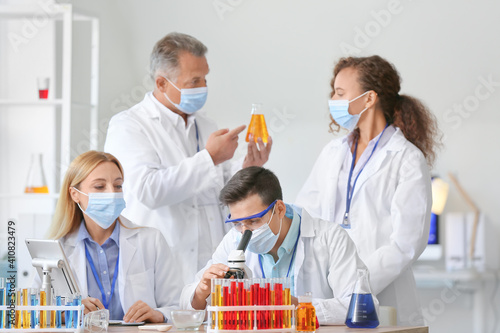Scientists working with sam...