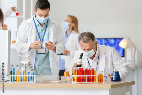 Scientists working with sam...