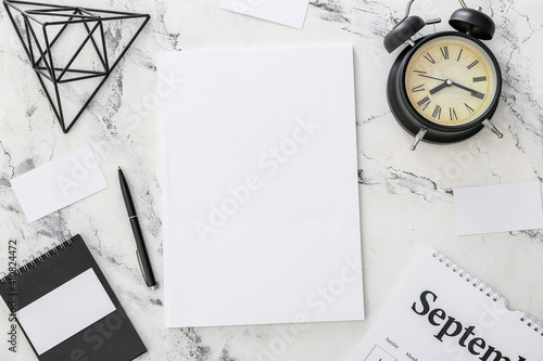 Blank magazine, alarm clock...