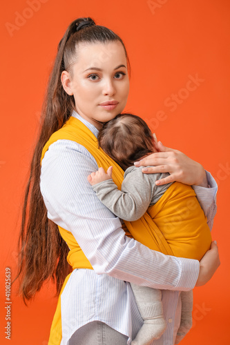 Young mother with little ba...