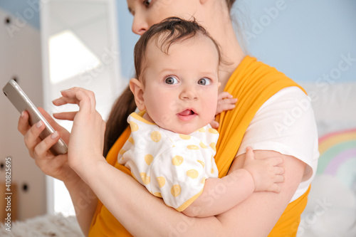 Young mother with little ba...