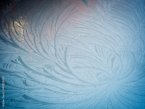 Ice flowers in wintr at a windscreen of a car