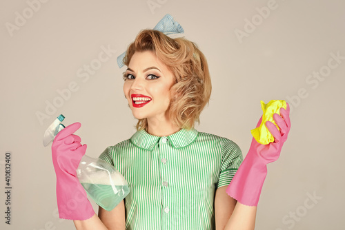 Housekeeper woman with cleaning products. Cleaning, retro style, purity. Quality home cleaning, housewife. House cleaning service.