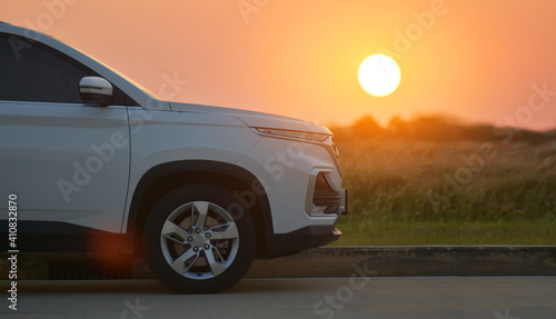 SUV Car parked on road sunset background and Car travel on road trip © Suriyo