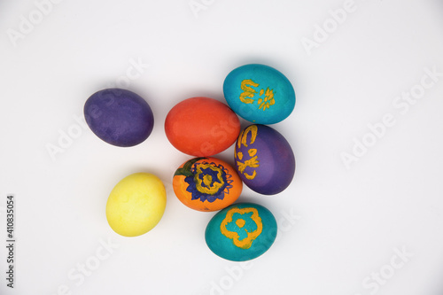 Painted Easter eggs lie on a white background.