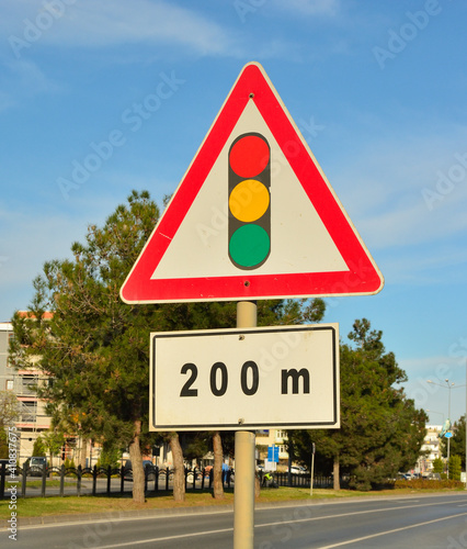 Traffic sign. Traffic lghts after 200 meters. photo