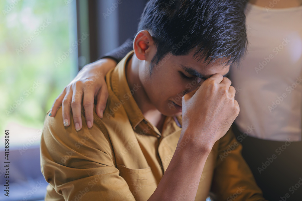 Tired businessman with eye pain during working in office overwork and got care by his colleague. Tired businessman with eye pain during working in office overwork and got care by his colleague.