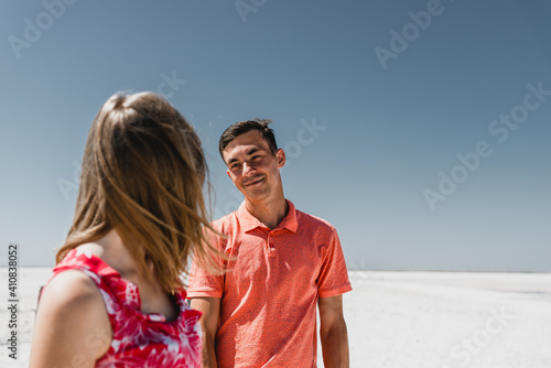 lovers in the desert. couple walks along the trail. the road to the far. a guy with a girl in a non-forged place date of a young couple. white desert