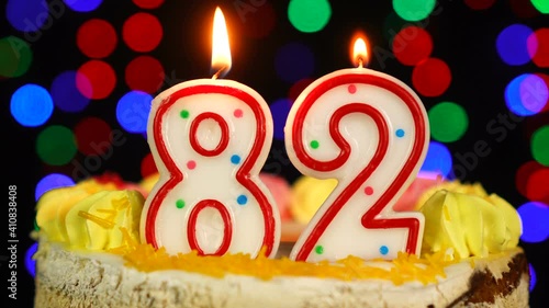 Number 82 Happy Birthday Cake With Burning Candles Topper.