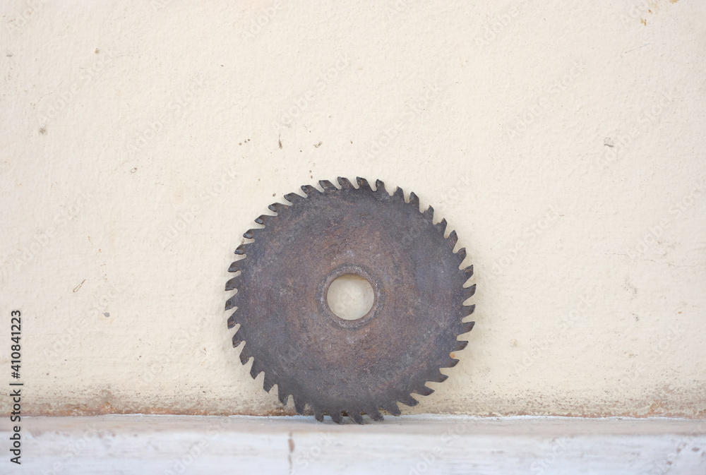 Old circle sharp diamond blade leaning on the wall Old circle sharp diamond blade leaning on the wall
