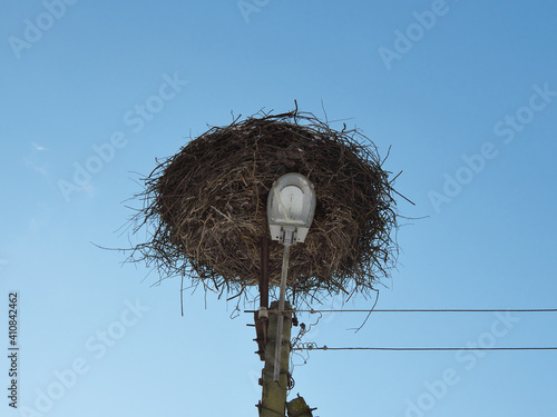 Place for storks nest on street lighting pole.