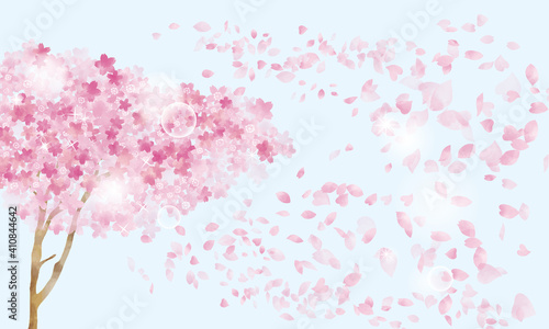 水彩風 桜の木と舞う花びらとキラキラ（背景ブルー）