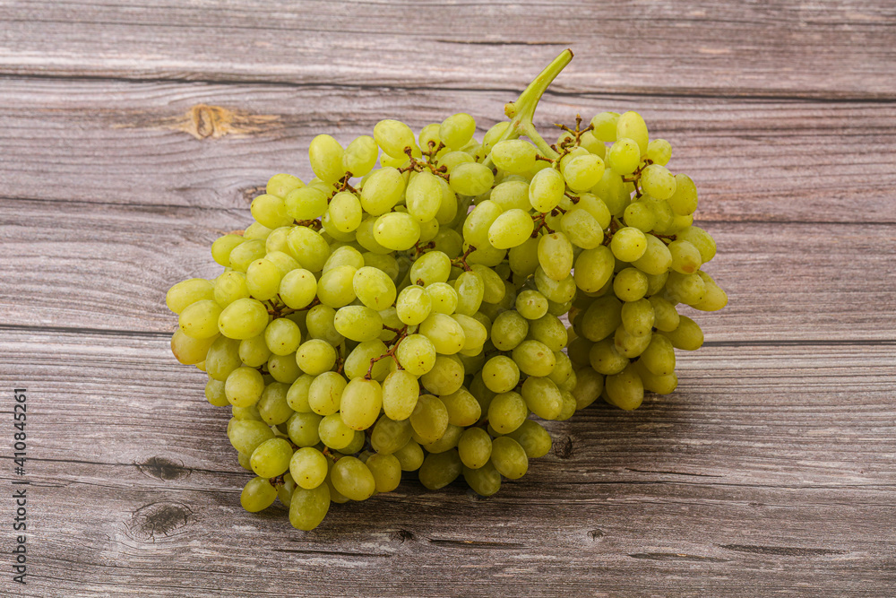 Green grape branch over background Green grape branch over background
