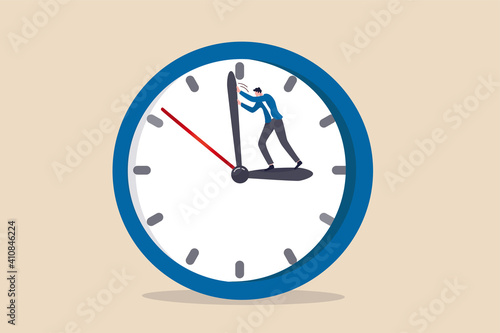 Turn back time to change or fix mistake, inevitable failure or urgency closed to deadline concept, businessman standing on clock hour hand manage to push back minute hand to turn back time.