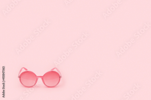 Pink glasses in the corner image on a pink background, poster for Valentine's Day.