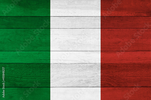 Italy national flag painted on a wooden plank background.