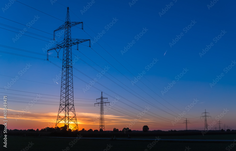 Fototapeta premium Beautiful sunset with overland high voltage lines near Tabertshausen, Bavaria, Germany